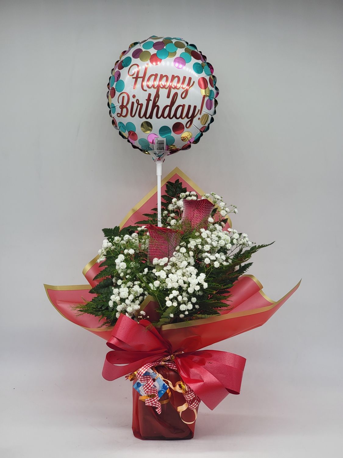 Roses  - 2 red in a red wrap with a balloon