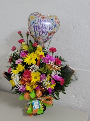 Cut flowers in a wrap and a balloon 