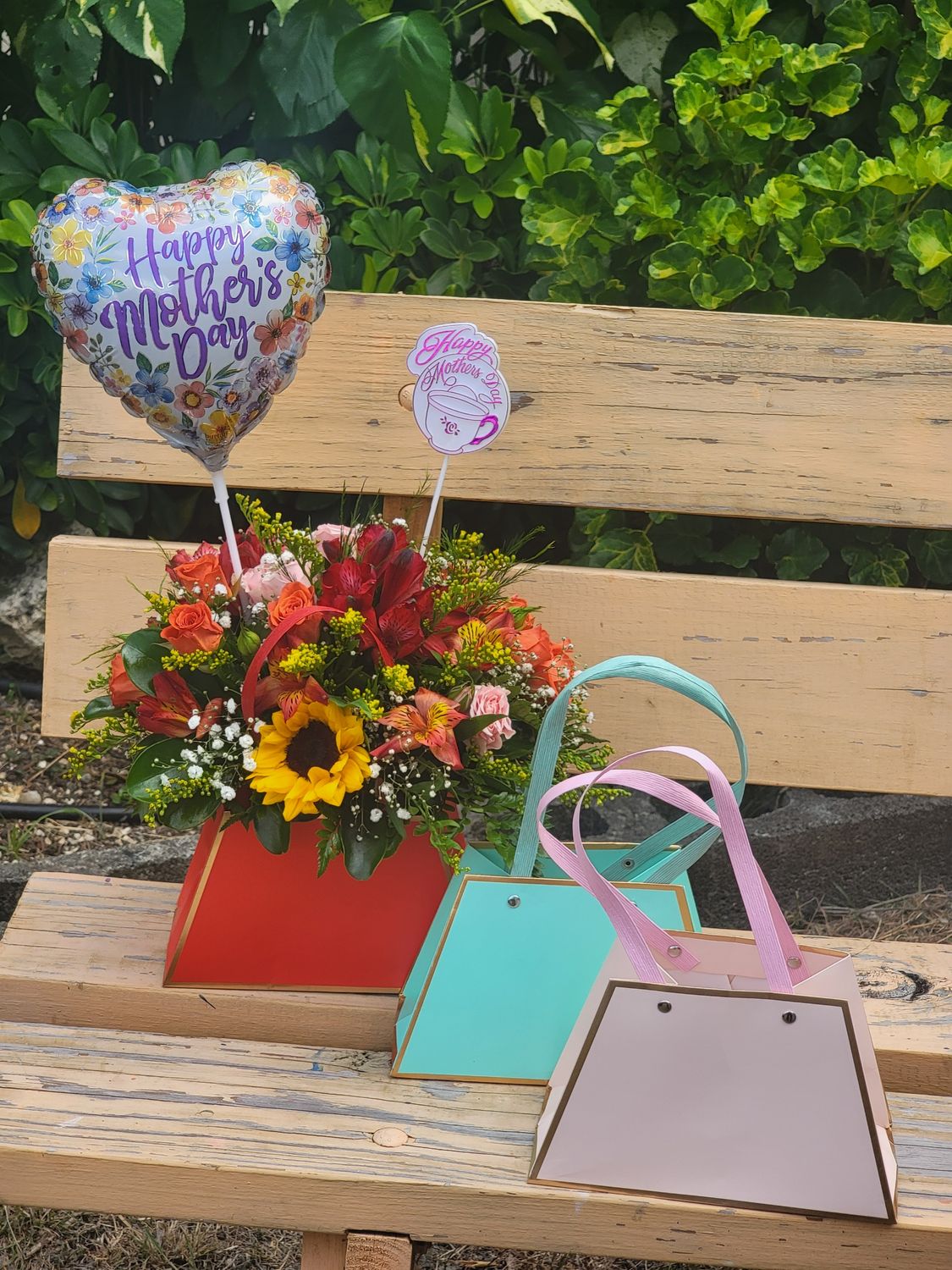 Mix cut flower in a hand bag/balloon