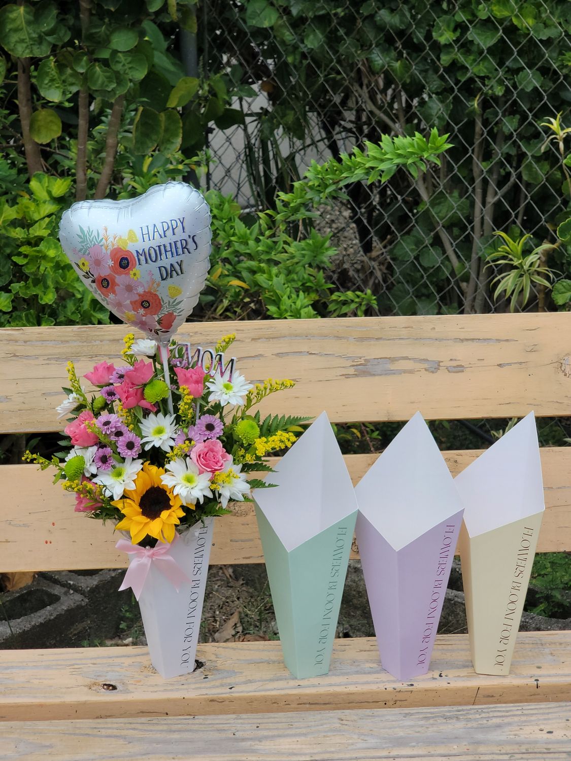 Cut flowers in a box with a balloon