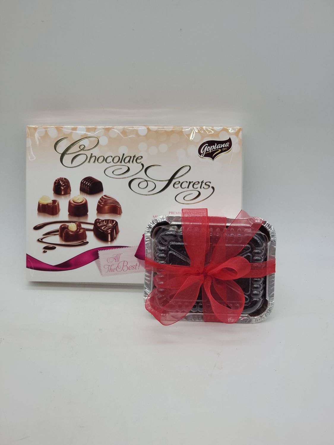 114g Chocolates and a 6"x 6"  square Christmas Cake