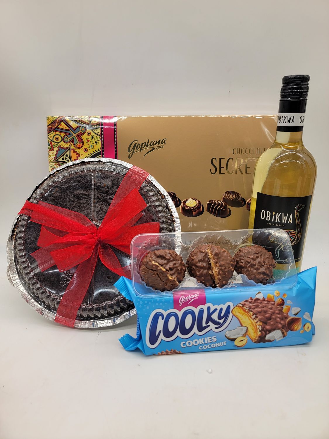 238g Chocolates, white wine, 8" round cake, cookies