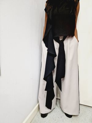 CARACLAN GREY WIDE LEG TROUSERS WITH BLACK SATCH BELT AND BLACK SIDE PIPING