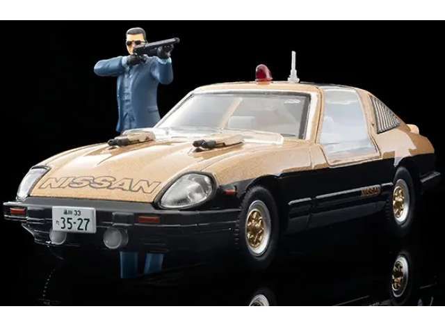 1:64 Tomica Limited Vintage - Movie Stars 01 Seibu Keisatsu Super Z with Keisuke Daimon Figure, gold/black 1:64 Tomica Limited Vintage - Movie Stars 01 Seibu Keisatsu Super Z with Keisuke Daimon Figure, gold/black