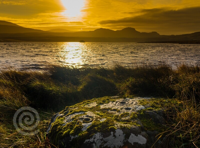 Winter light over Lough Fad and ancient Rock art in Mindoran