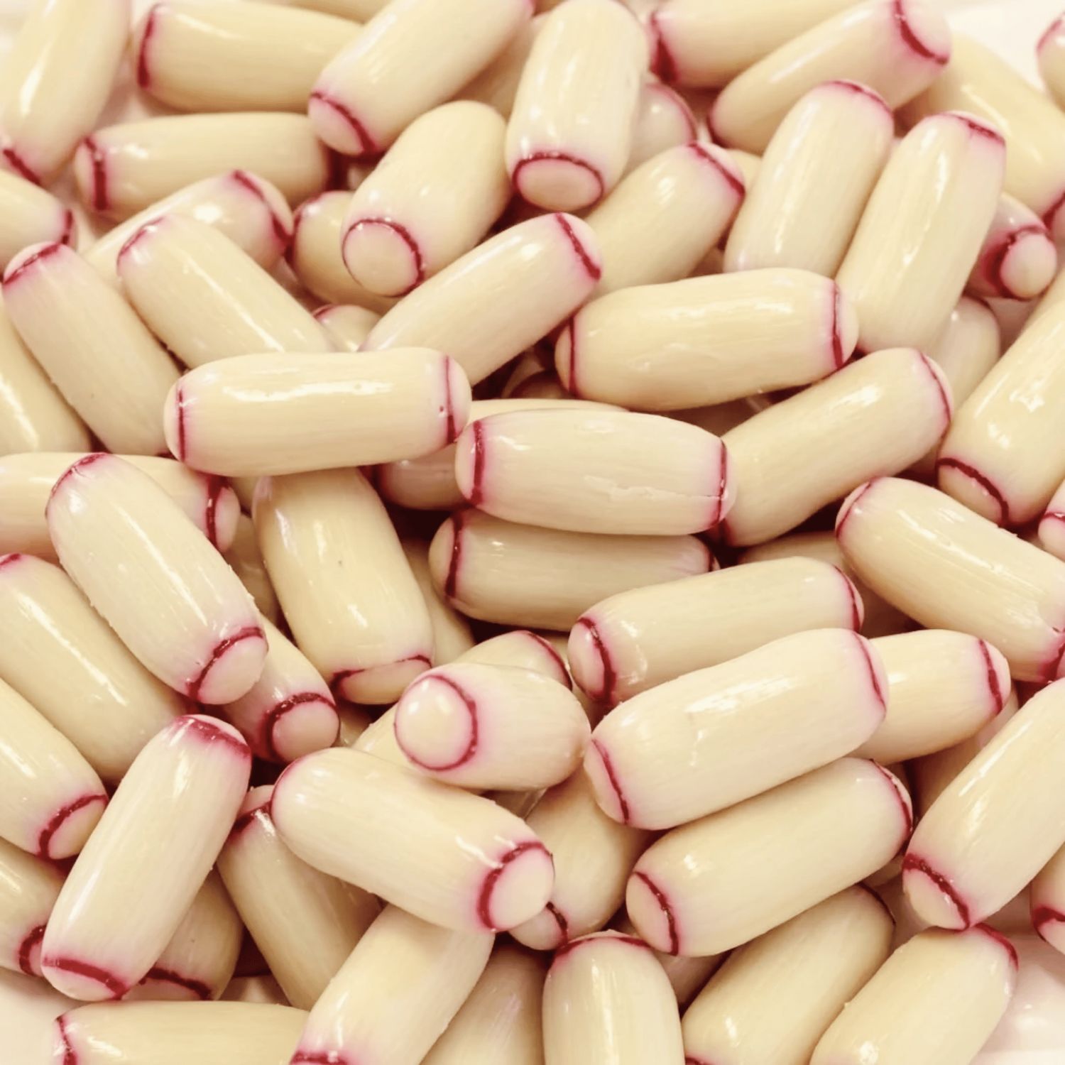 Chocolate Coated Raspberry Bullets - White Choc (Darrell Lea) 875g