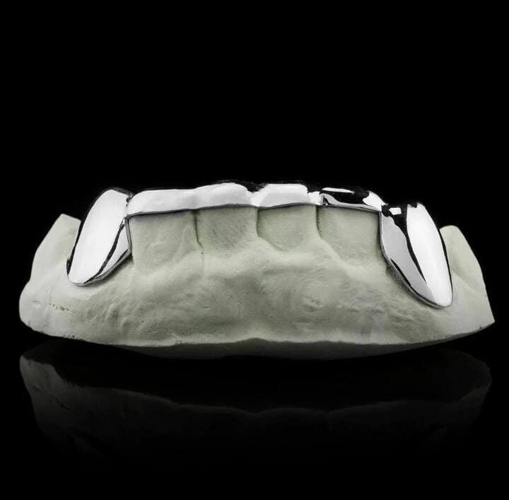925. Sterling silver 6 count 2 fangs and a bridge