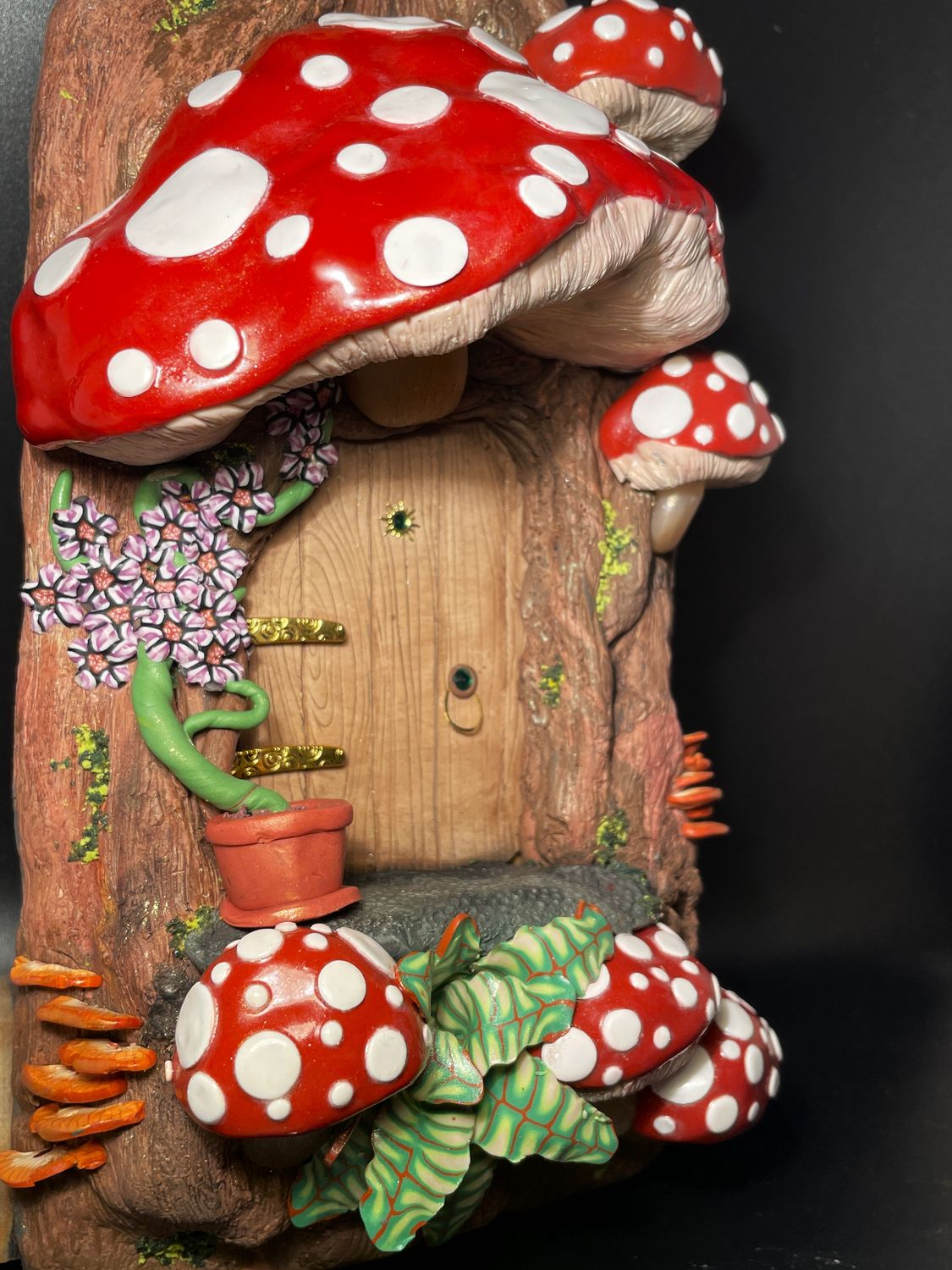 Fairy Door surrounded by Red Cap Mushrooms