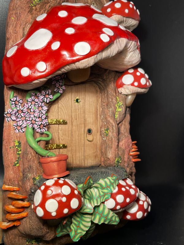 Fairy Door surrounded by Red Cap Mushrooms