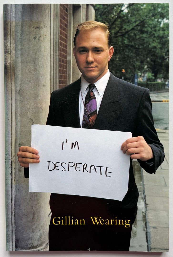 [SIGNED] GILLIAN WEARING SIGNS THAT SAY