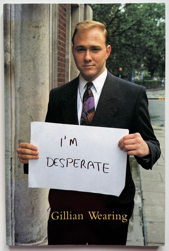 [SIGNED] GILLIAN WEARING SIGNS THAT SAY