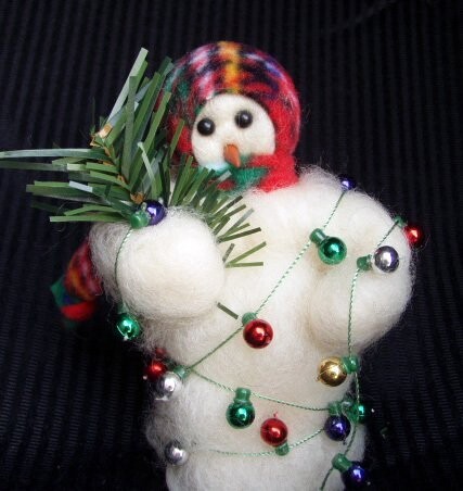 All Tangled Up Wooly Primitive Snowman Holding festive greens