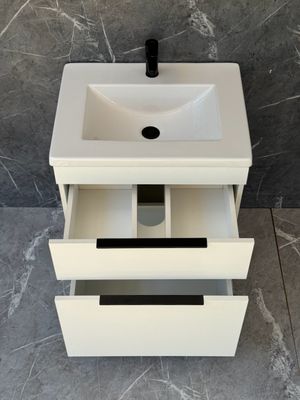 TAO-600 Floor Standing Cabinet &amp; Basin with black handles and legs.