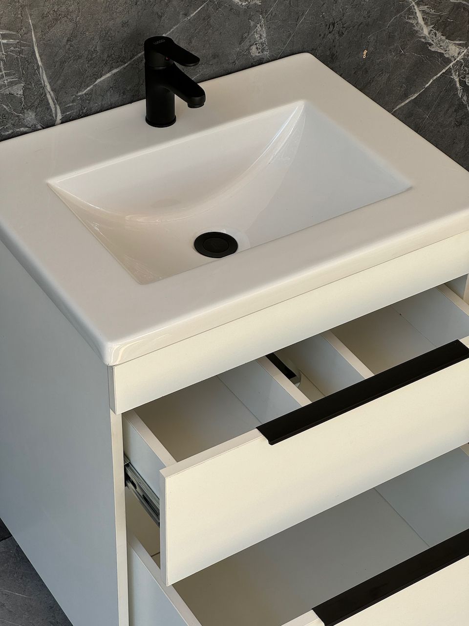 TAO-600 Floor Standing Cabinet &amp; Basin with black handles and legs.