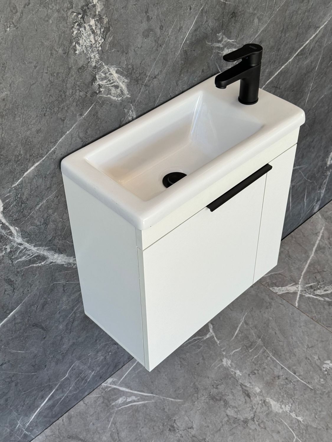 ELIN-500 Wall Mounted Cabinet &amp; Basin with black handle.