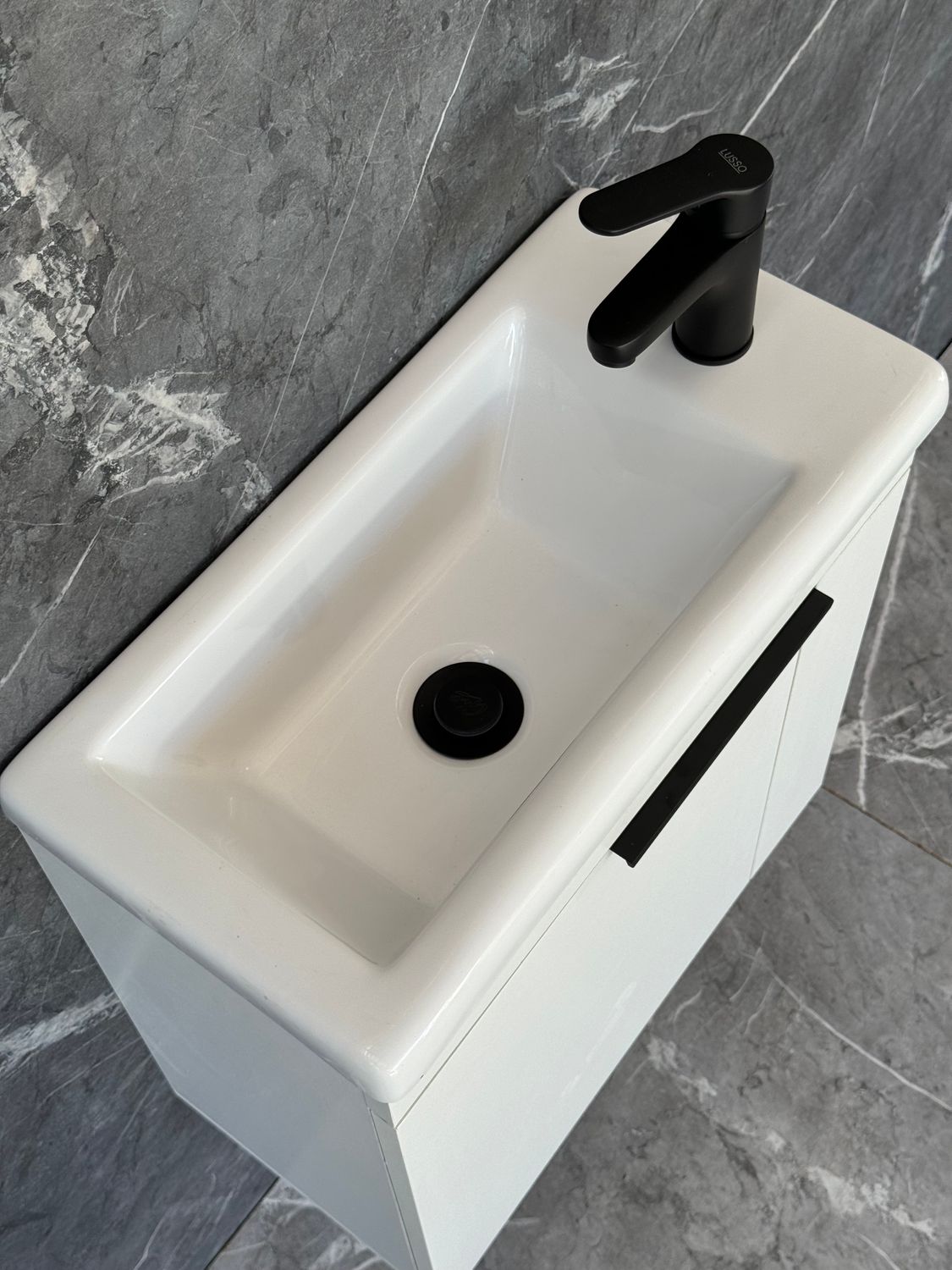 ELIN-500 Wall Mounted Cabinet &amp; Basin with black handle.