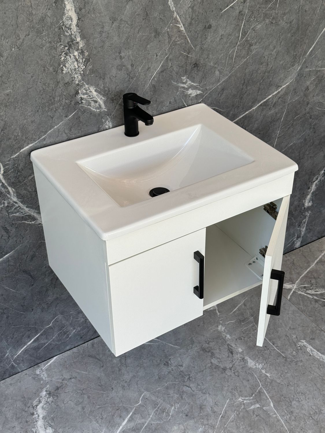 OASIS-600 Wall Mounted Cabinet &amp; Basin with black handles.