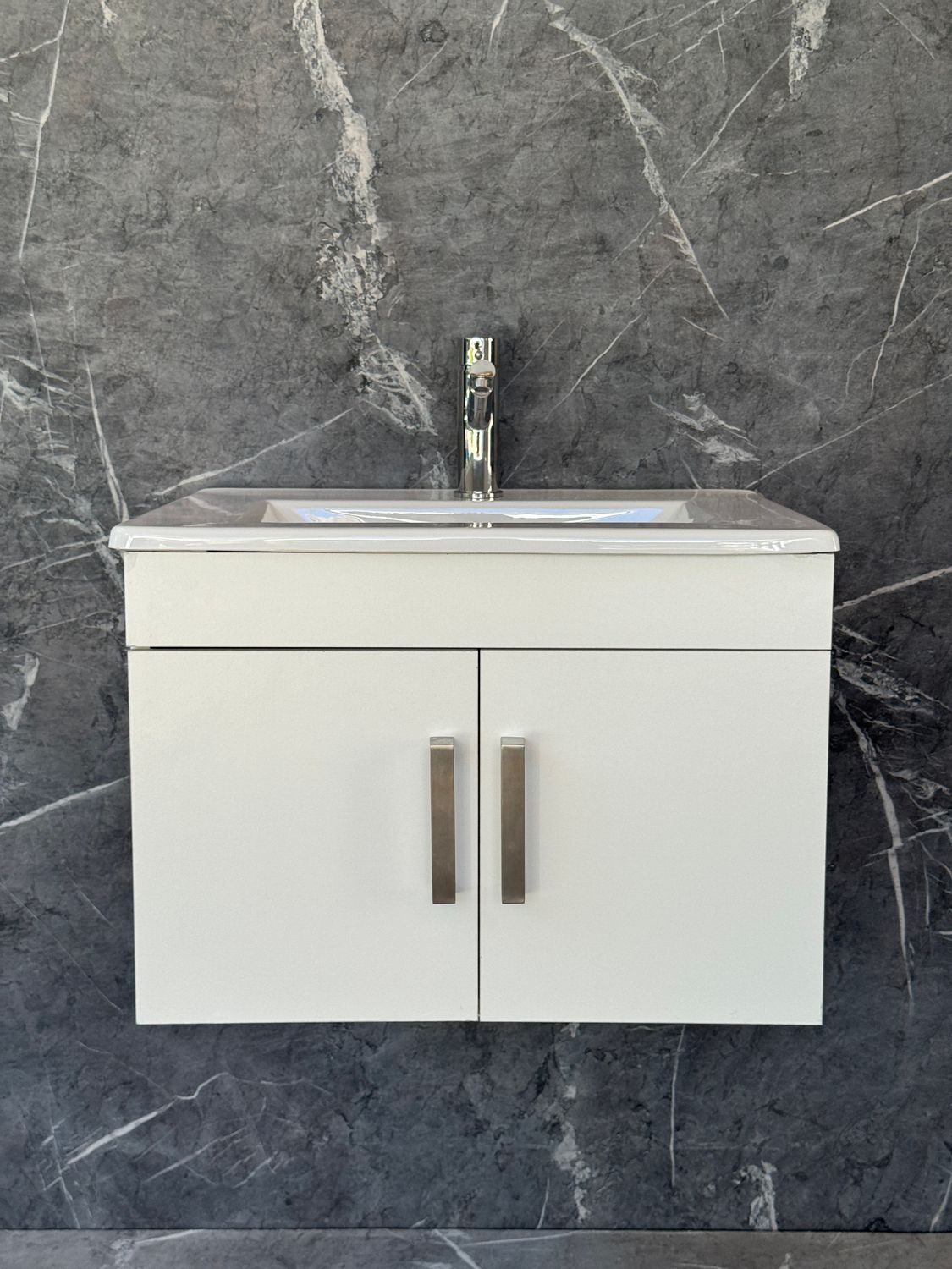 OASIS-600 Wall Mounted Cabinet &amp; Basin with silver handles.