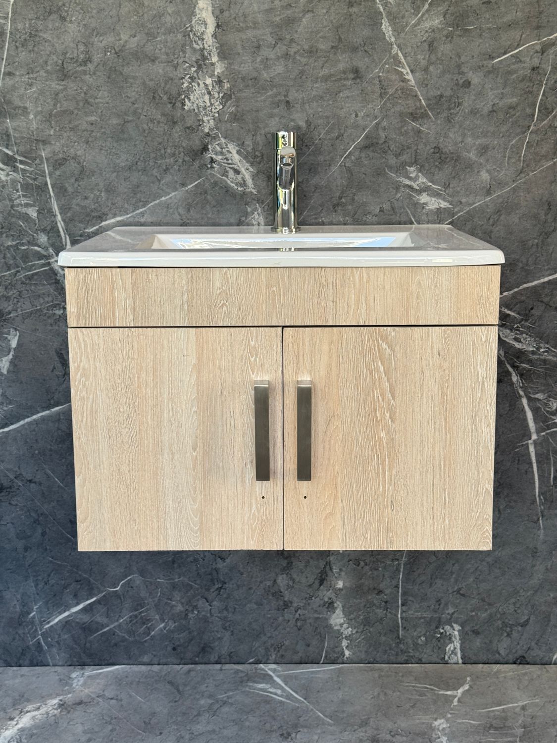 OASIS-600 Wall Mounted Cabinet &amp; Basin with silver handles.