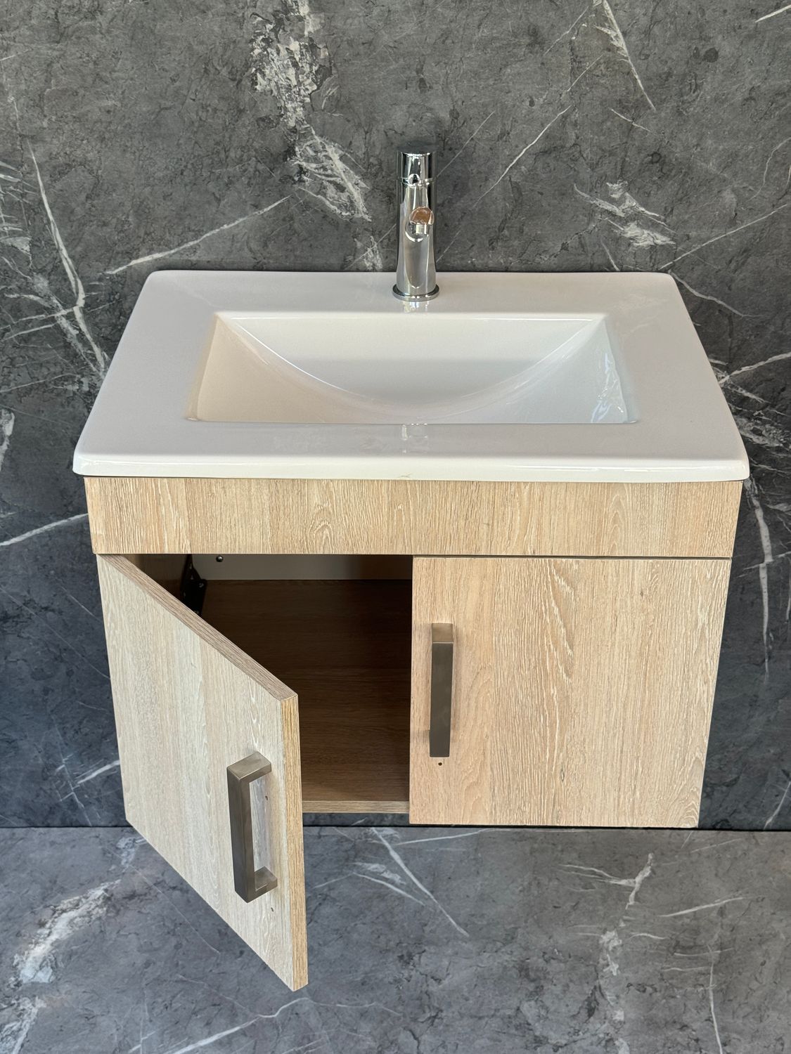 OASIS-600 Wall Mounted Cabinet &amp; Basin with silver handles.