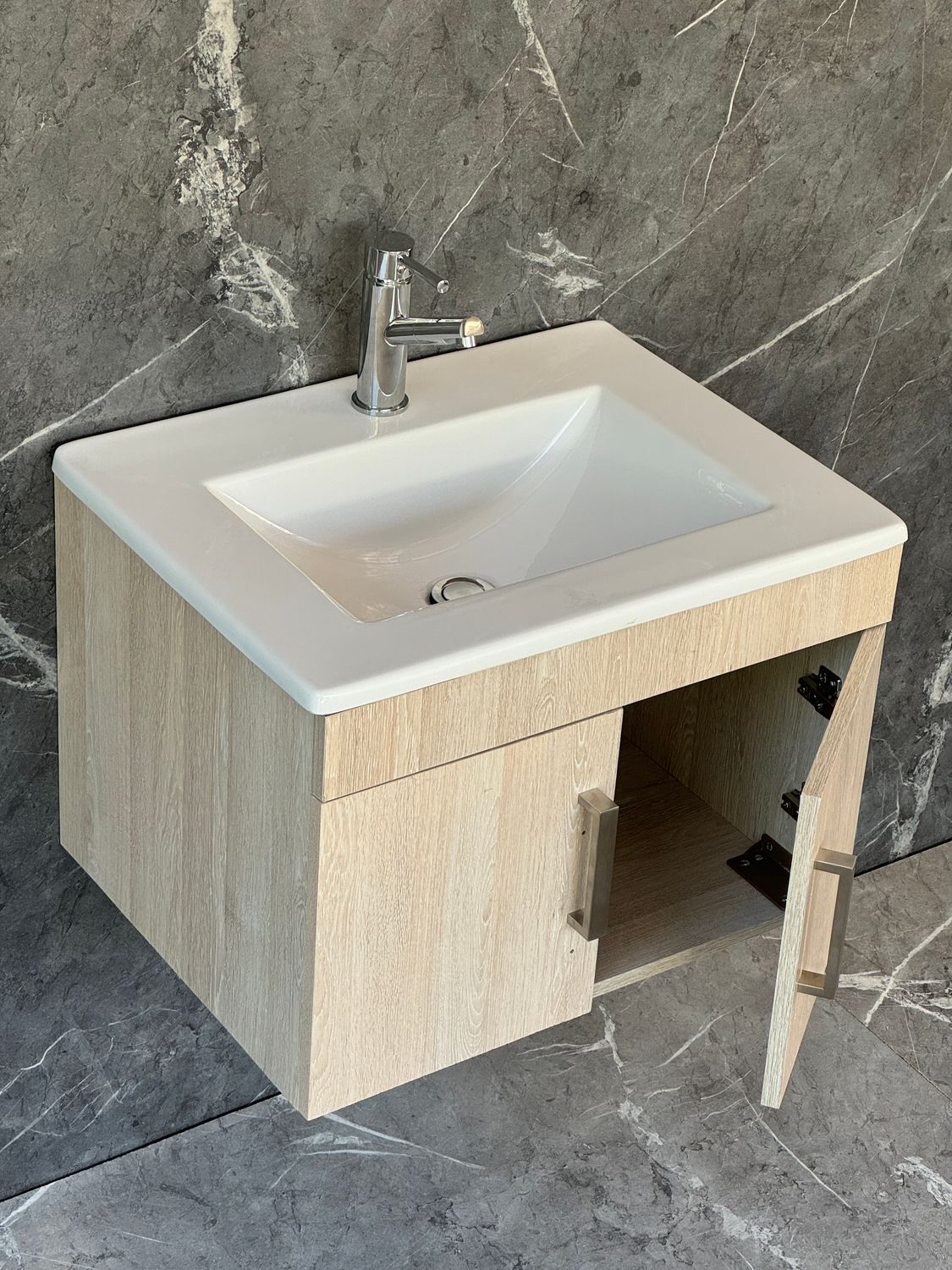 OASIS-600 Wall Mounted Cabinet &amp; Basin with silver handles.