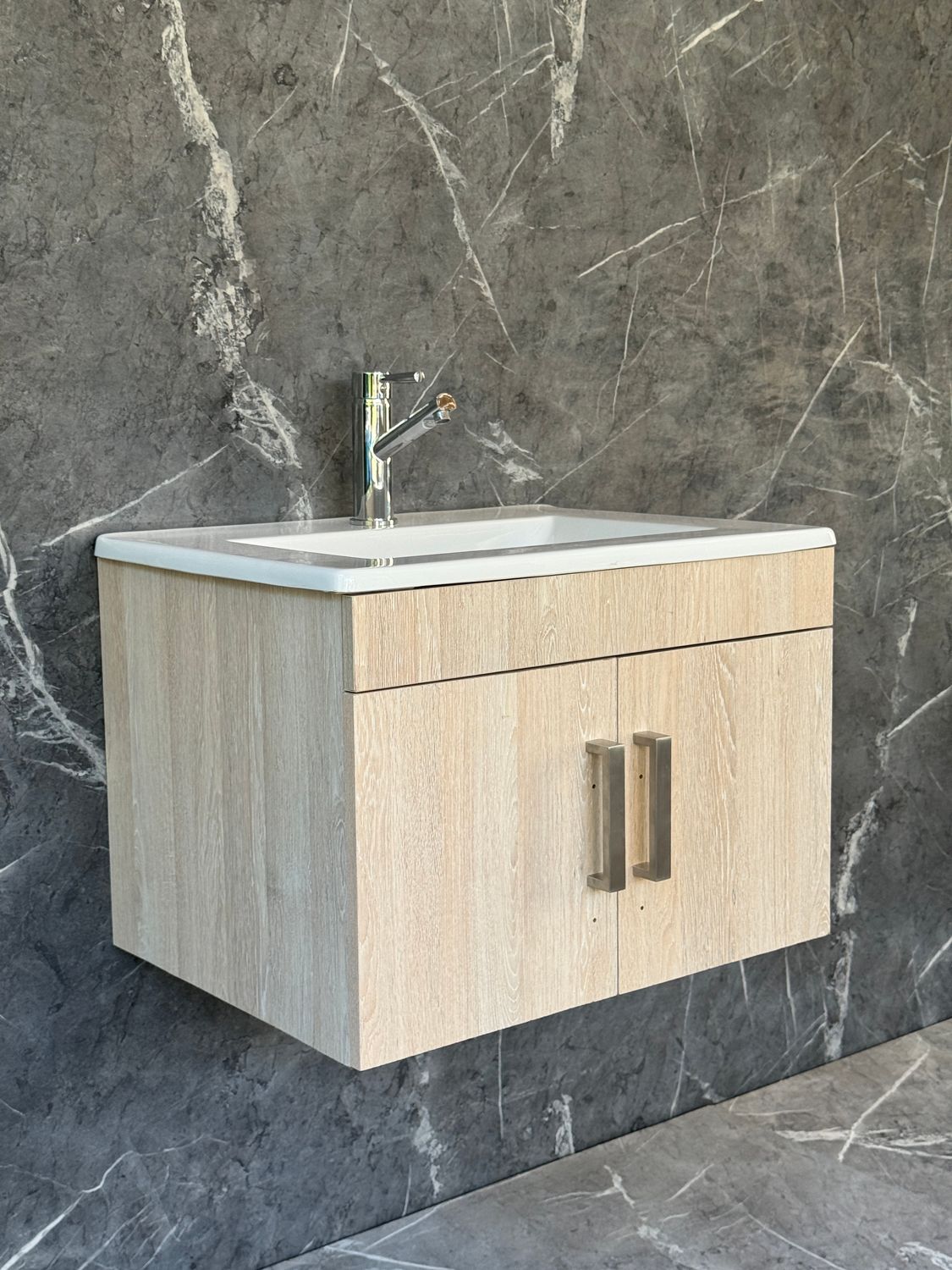 OASIS-600 Wall Mounted Cabinet &amp; Basin with silver handles.