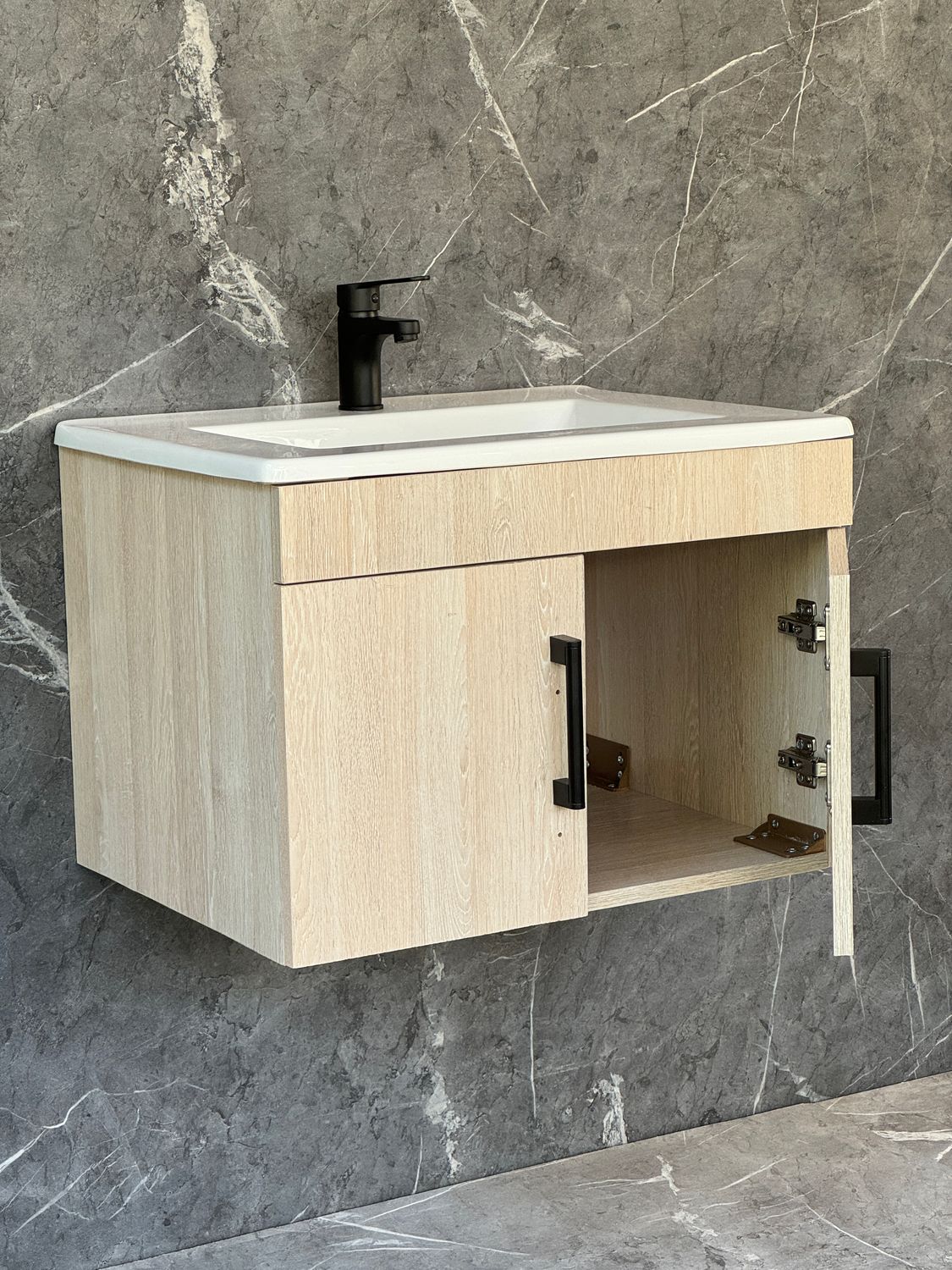 OASIS-600 Wall Mounted Cabinet &amp; Basin with black handles.