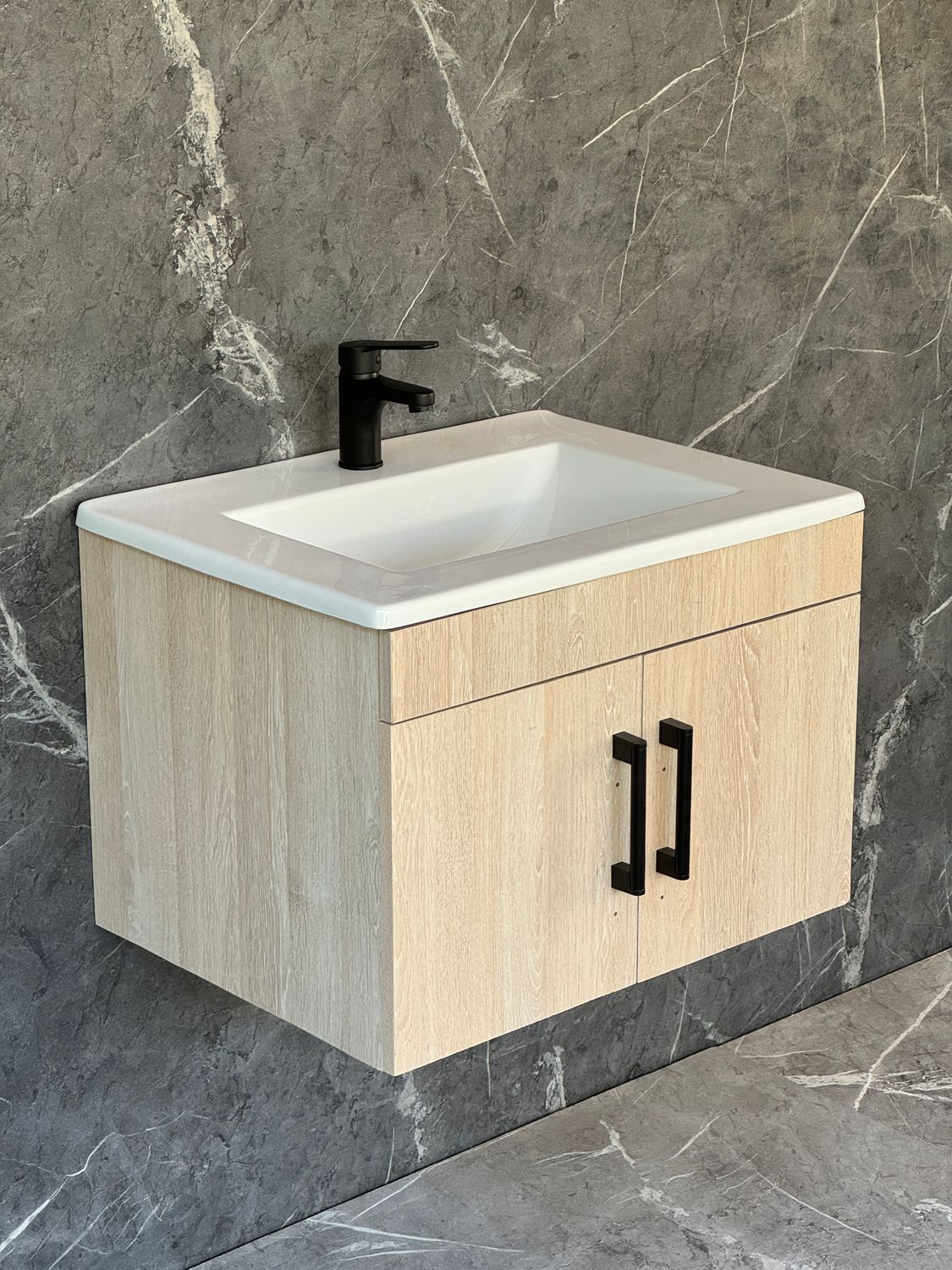 OASIS-600 Wall Mounted Cabinet &amp; Basin with black handles.