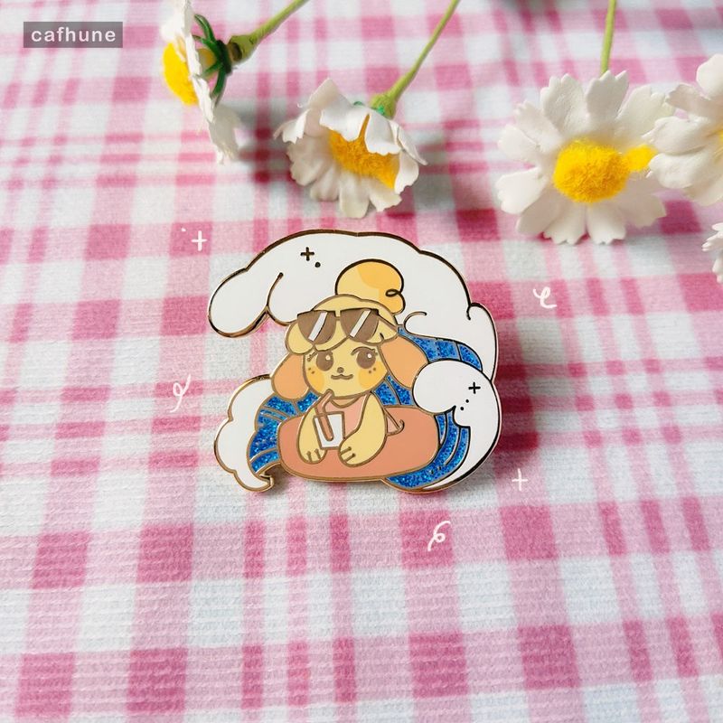 Isabelle beach enamel pin