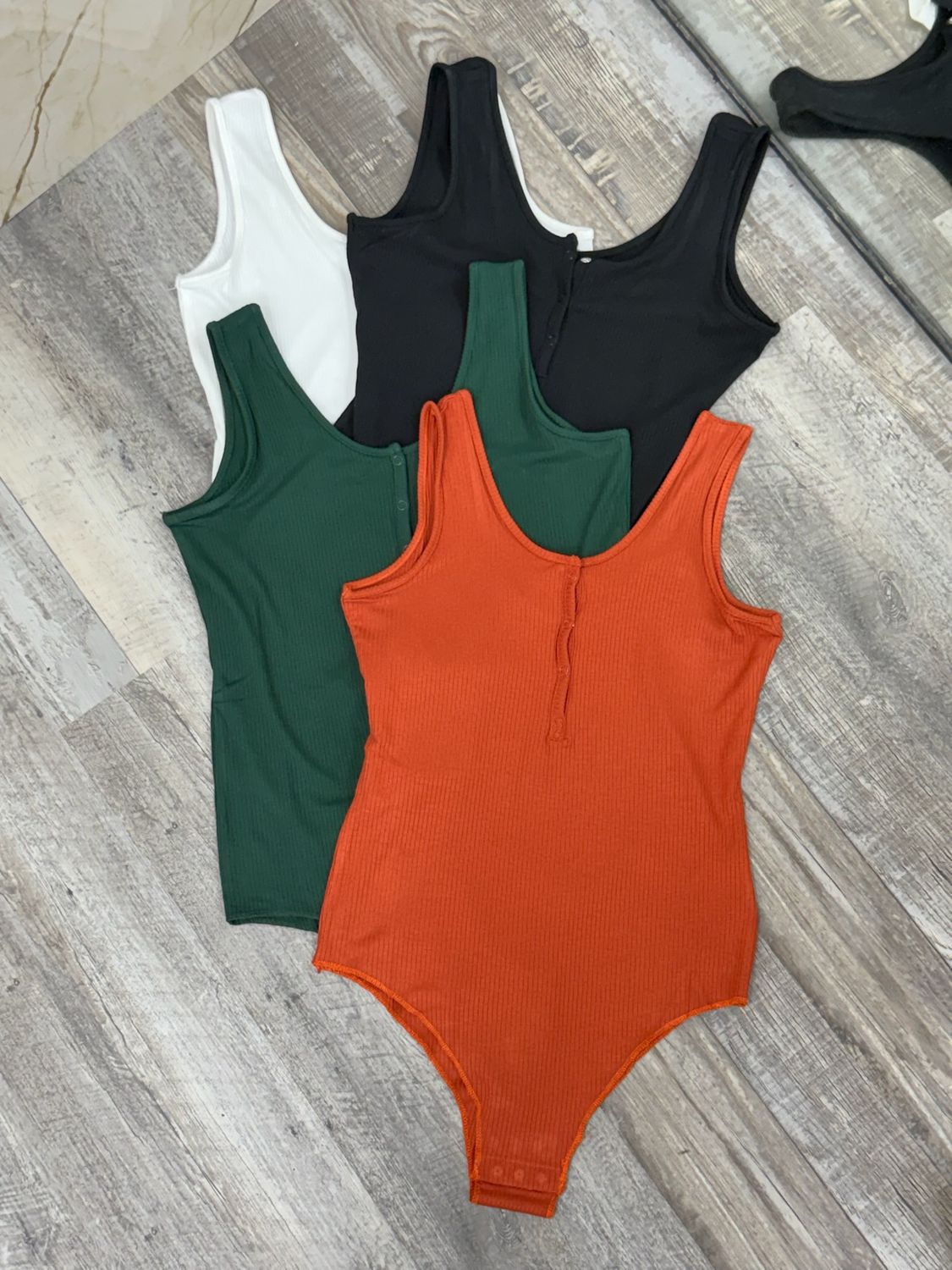 Body musculosa con botones