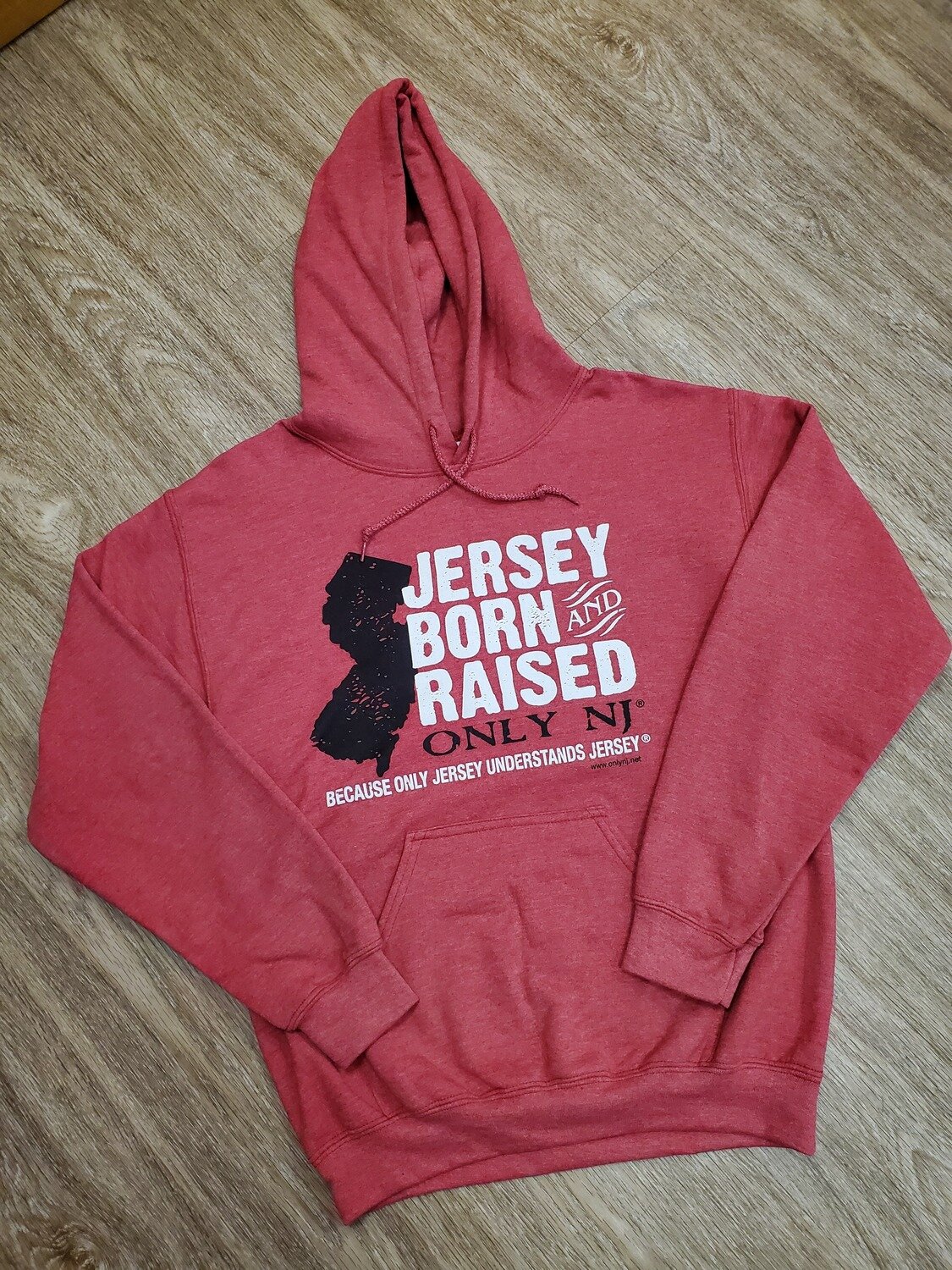 Red hooded sweatshirt with a black silhouette of the state of New Jersey and the words &quot;Jersey Born &amp; Raised&quot; in white followed by &quot;Only NJ&quot; in black and then &quot;because only Jersey understands Jersey&quot; below that 