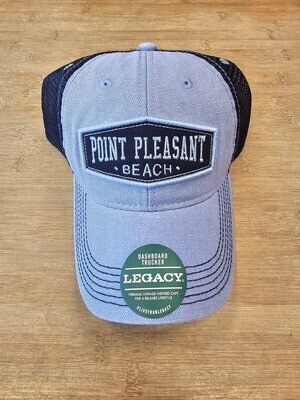 Front of a Legacy brand Point Pleasant Beach trucker-style hat with adjustable strap.