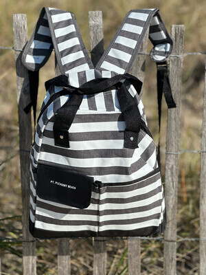 Grey and white striped backpack with Pt. Pleasant Beach written on a black pocket flap