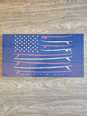 Rectangular navy sign with an American flag-inspired surfboard design that has red and white surf boards in place of the stripes on the flag
