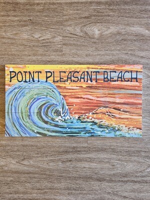 Horizontal wood sign with a multicolor wave set against a sunset sky with &quot;Point Pleasant Beach&quot; on the top