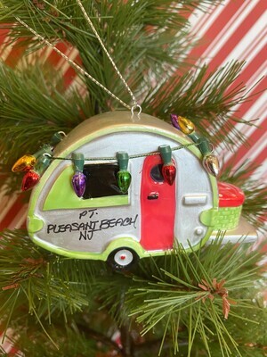 The front side of an ornament of a camper with holiday lights and Point Pleasant Beach, NJ