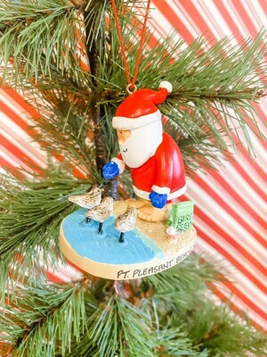 A Point Pleasant Beach, NJ​ ornament featuring Santa feeding three Sand Piper bird friends