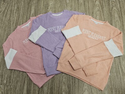 Terry crew sweatshirts that say Point Pleasant Beach shown in Coral, Lilac, and Pink