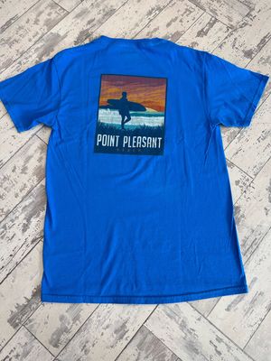 The back of a blue t-shirt with a surfer design and Point Pleasant Beach