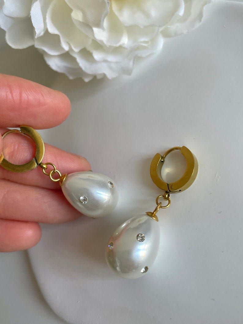 Argolla con perla colgante