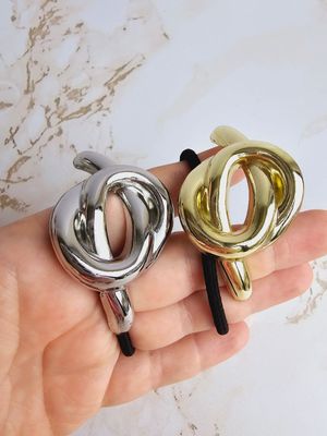 ​Colas de Cabello nudo
