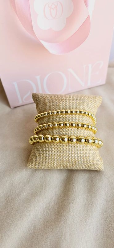 Pulseras "Esfera Dorada"