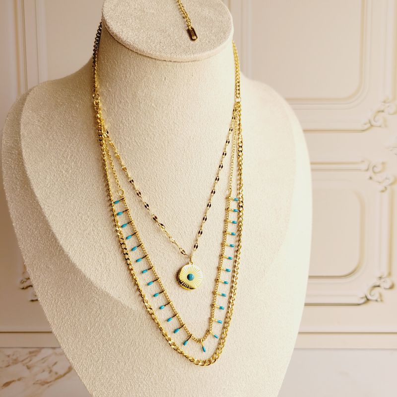 Gargantilla Triple de Acero Dorado con dije de Ojo y Piedras Celestes