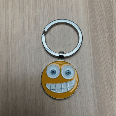 Emoji sleutelhanger - Forced smile