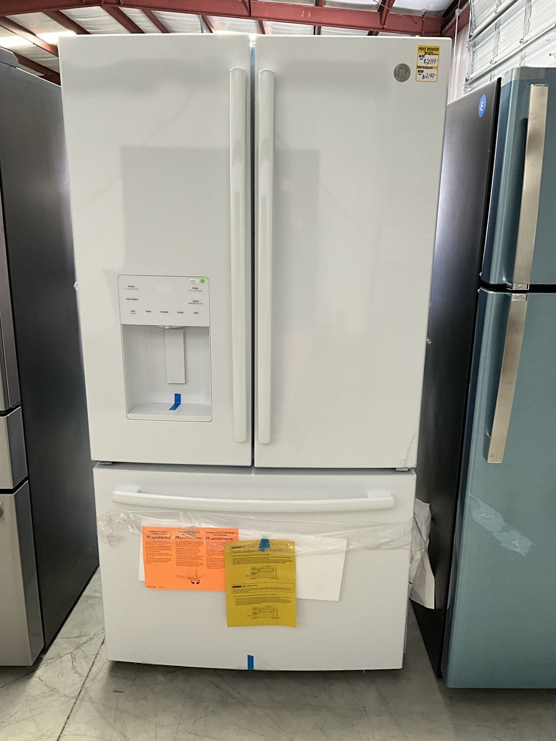 GE 25.6 Cu. Ft. French Door Refrigerator w/ Ice Maker in the door - White  Model GFE26JGMWW. MSRP $2599