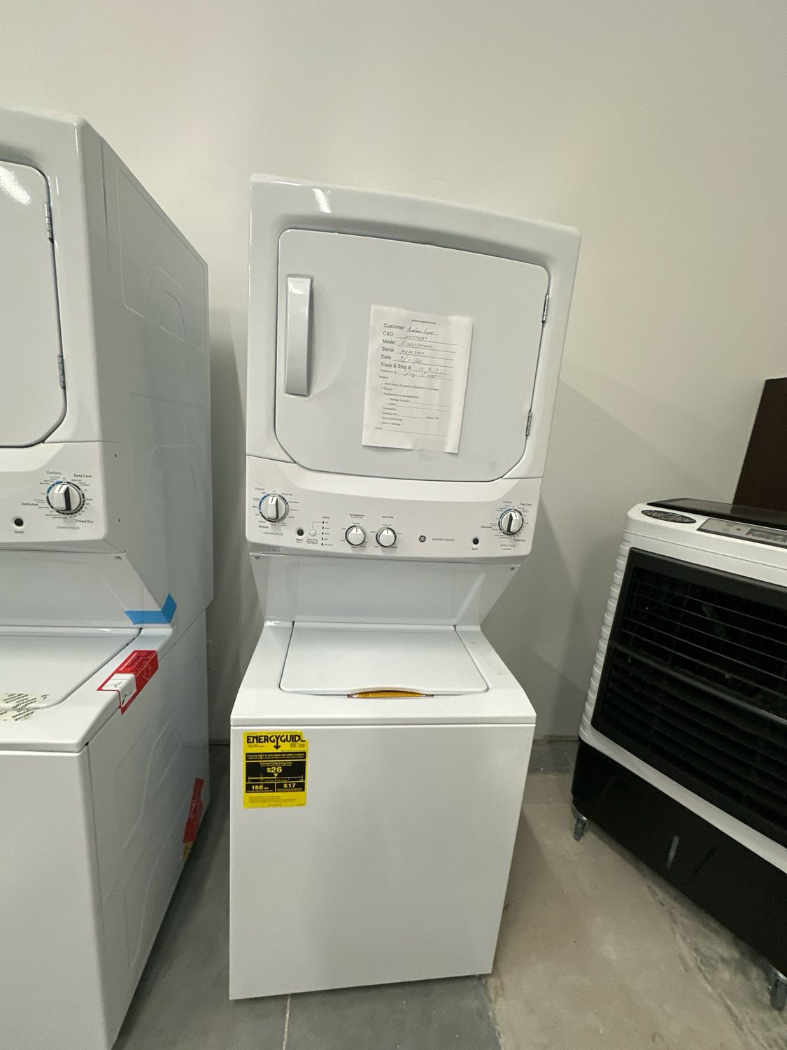 GE GUV27ESSMWW Unitized Spacemaker® 3.8 cu. ft. Capacity Washer with Stainless Steel Basket and 5.9 cu. ft. Capacity Long Vent Electric Dryer