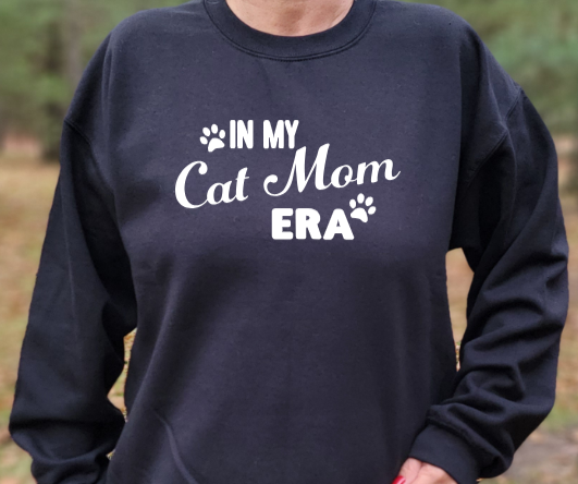 In my Cat Mom Era Unisex tshirt or crewneck sweatshirt with logo on back