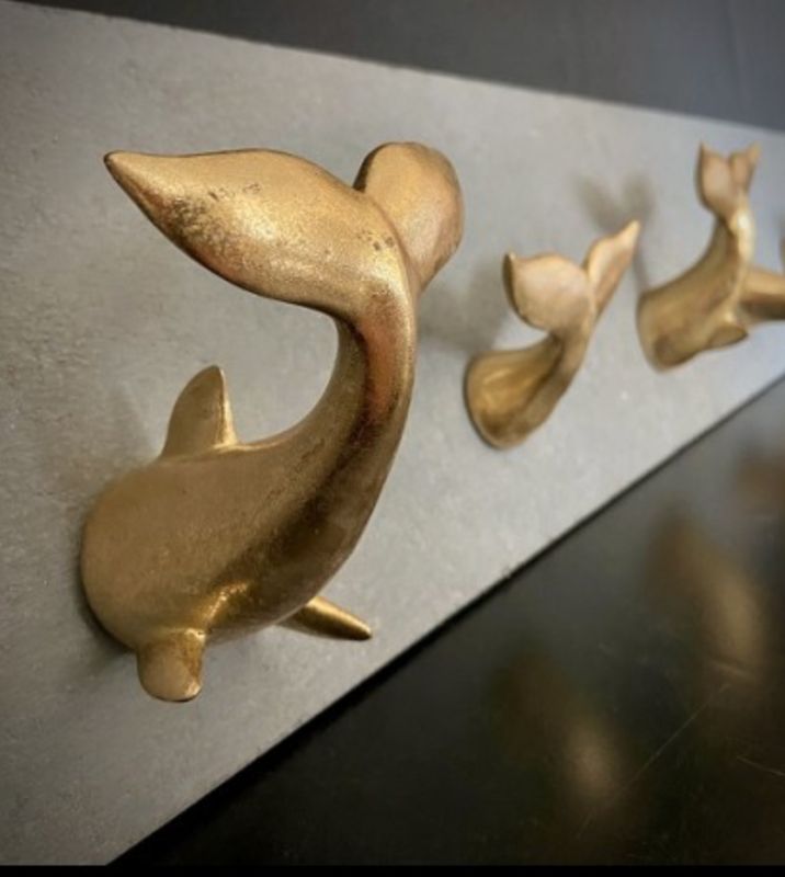 Gold Resin Whale Tail on Cement Panel