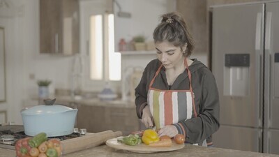 a woman cooking in the kitchen