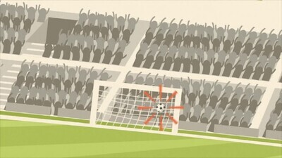 a man kicks a football on the stadium